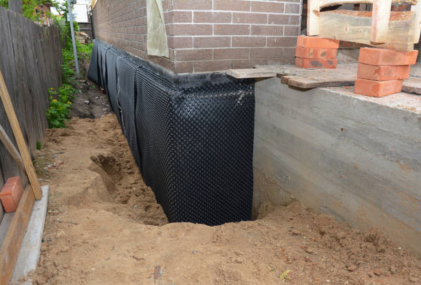Happy homeowners after waterproofing job in White Marsh